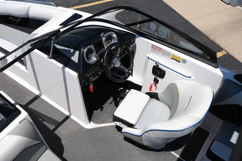 Slide: The Image of 2017 Moomba Mondo boat interior with steering wheel and seating. - 15