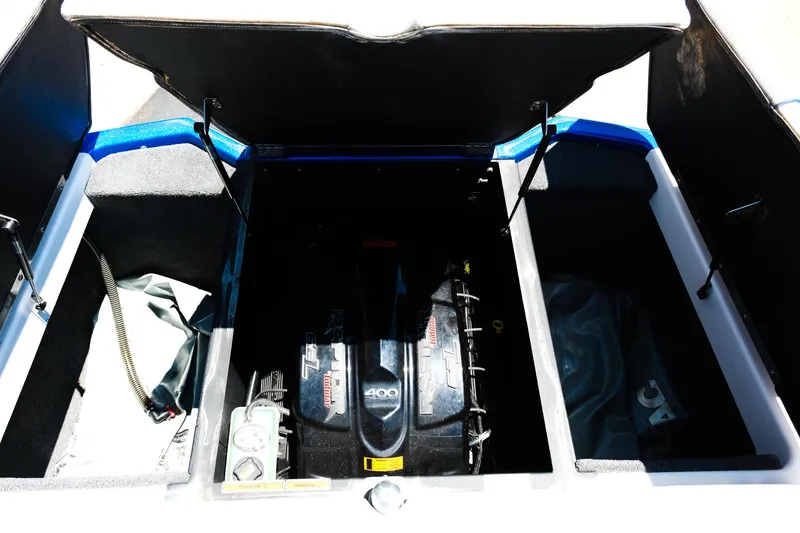 Slide: The Image of 2017 Moomba Mondo engine compartment with open hatch, showcasing engine and storage areas. - 18