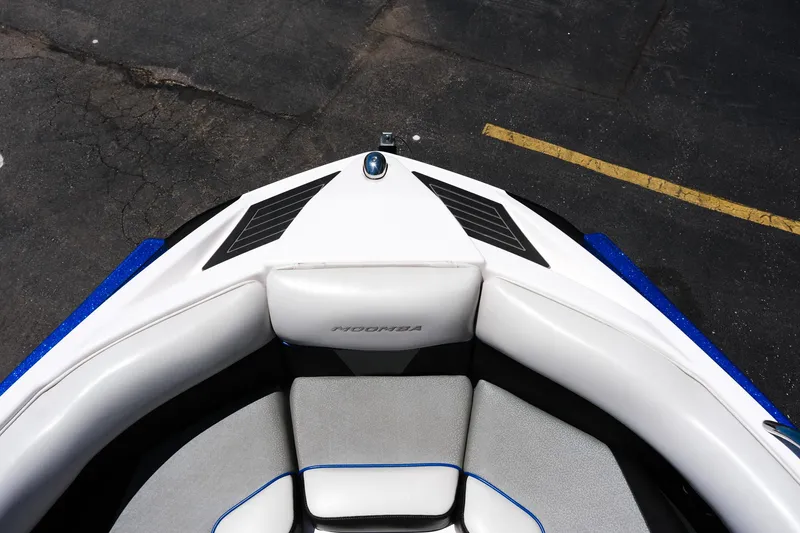 Slide: The Image of 2017 Moomba Mondo boat bow with white seating and blue accents. - 20