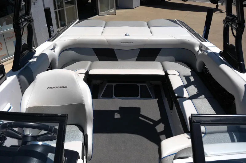 Slide: The Image of 2017 Moomba Mondo boat interior with gray seating and open layout. - 21