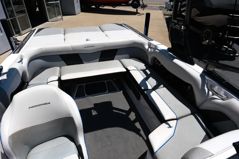 Slide: The Image of 2017 Moomba Mondo boat interior with gray seating and spacious layout. - 22