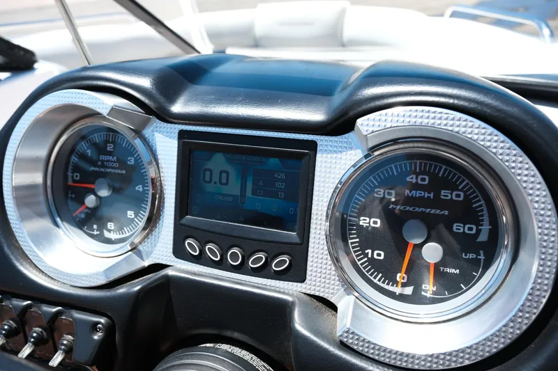 Slide: The Image of Dashboard of a 2017 Moomba Mondo boat with speedometer and tachometer gauges. - 24