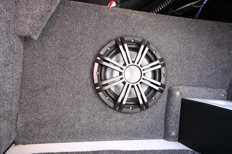 Slide: The Image of 2017 Moomba Mondo boat interior with a mounted speaker on gray carpet. - 27