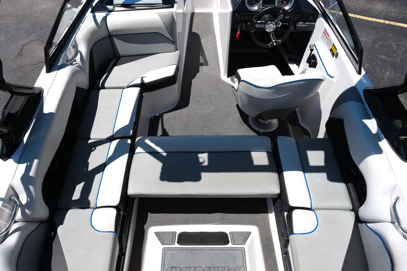 Slide: The Image of 2017 Moomba Mondo boat interior with gray seating and steering wheel. - 28