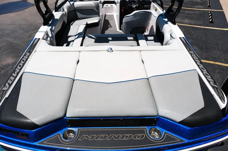 Slide: The Image of 2017 Moomba Mondo boat interior with cushioned seating and sleek design. - 30