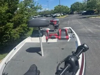 Slide: The Image of 2000 Skeeter SX 176 boat with seating, parked in a sunny lot. - 4