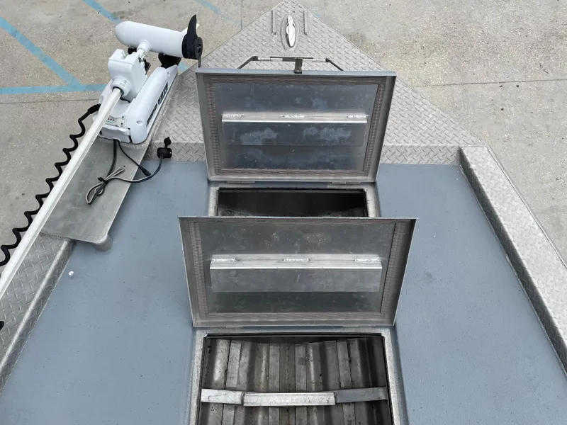 Slide: The Image of Open storage compartments on a 2009 Hanko 247 boat deck. - 10