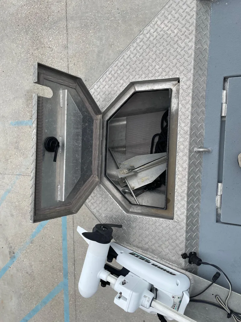 Slide: The Image of Open hatch on Hanko 247 boat, revealing storage compartment, 2009 model. - 11
