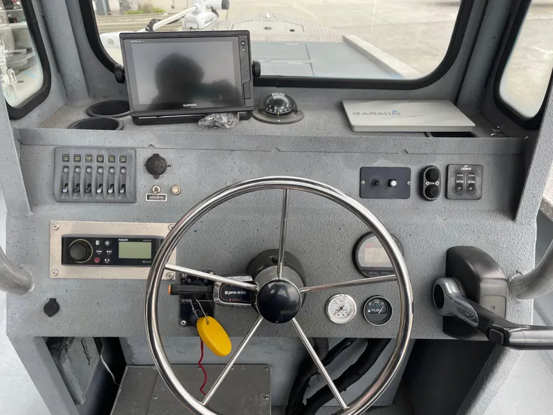 Slide: The Image of Boat cockpit with steering wheel, control panel, and navigation equipment, Hanko 247 model, 2009. - 16