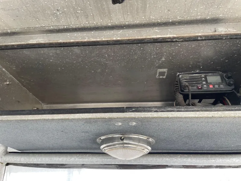 Slide: The Image of Open storage compartment with radio equipment in a Hanko 247, 2009 model. - 18