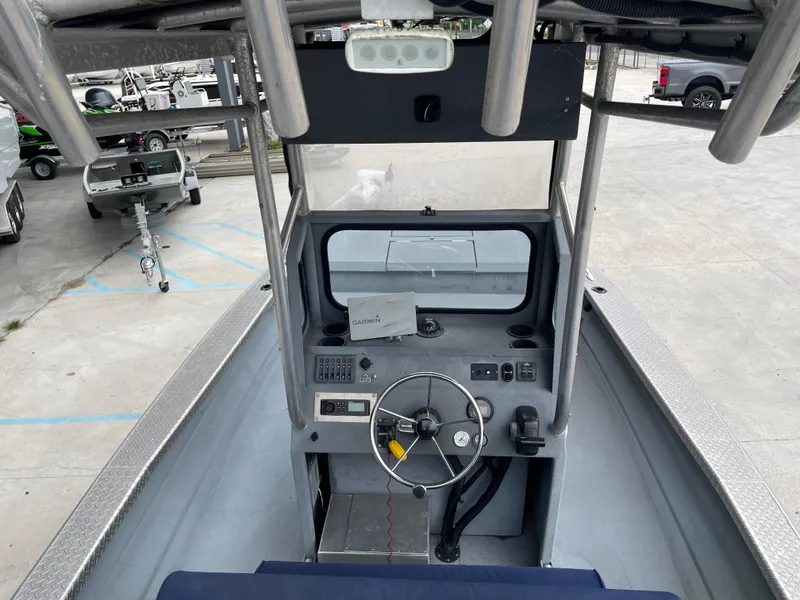 Slide: The Image of 2009 Hanko 247 boat cockpit with steering wheel and control panel. - 19