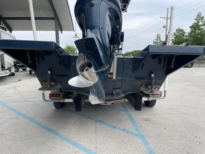 Slide: The Image of Rear view of a 2009 Hanko 247 boat with dual propellers in a parking area. - 21