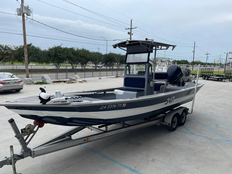 Slide: The Image of 2009 Hanko 247 boat on trailer in parking lot, overcast sky. - 7