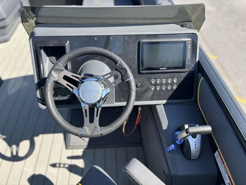 Slide: The Image of Steering console of 2023 Manitou Explore 22 Max Bench pontoon boat. - 10
