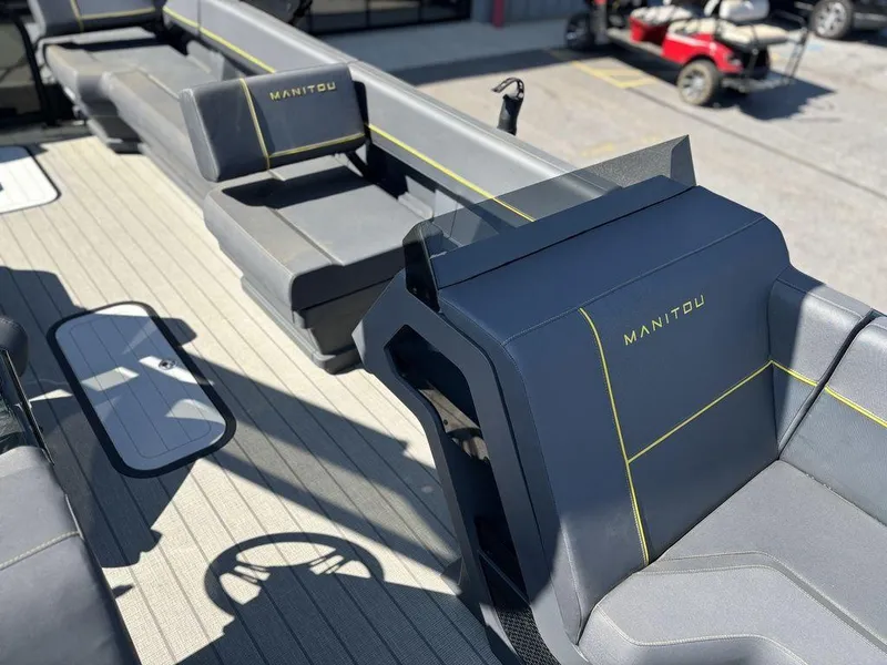 Slide: The Image of 2023 Manitou Explore 22 Max Bench interior with sleek seating and modern design. - 12