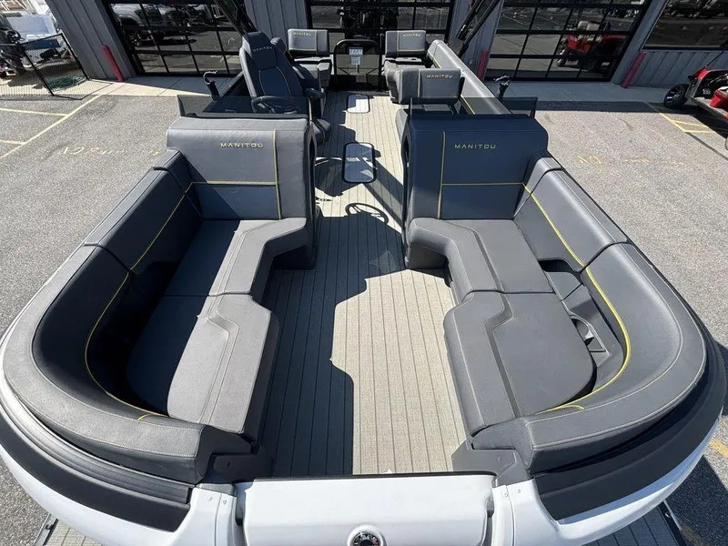 Slide: The Image of 2023 Manitou Explore 22 Max Bench pontoon boat with spacious seating and modern design. - 16