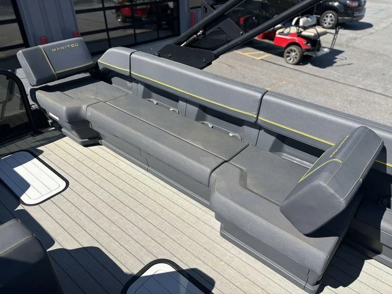 Slide: The Image of 2023 Manitou Explore 22 Max Bench with sleek gray seating and modern design. - 6