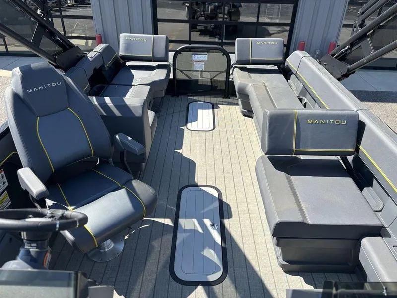 Slide: The Image of 2023 Manitou Explore 22 Max Bench interior with gray seating and modern design. - 7