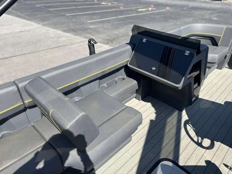 Slide: The Image of 2023 Manitou Explore 22 Max Bench interior with modern seating and control panel. - 8