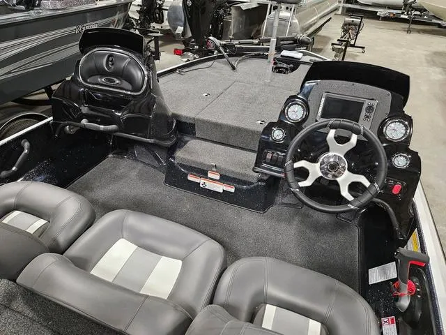 Slide: The Image of Interior of a 2025 Nitro Z17 boat with dual consoles and seating. - 4