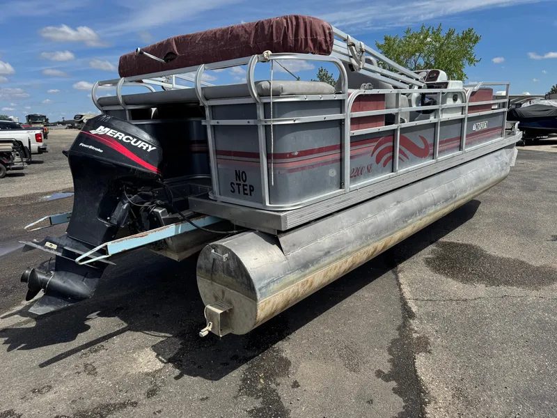 Slide: The Image of 2001 Paragon 2200SE pontoon boat with Mercury outboard motor, parked on asphalt. - 3