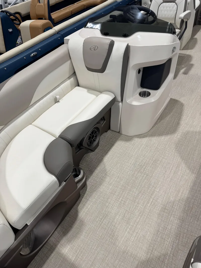 Slide: The Image of 2024 Avalon 2385 25 LSZ QL boat interior with modern seating and console design. - 2