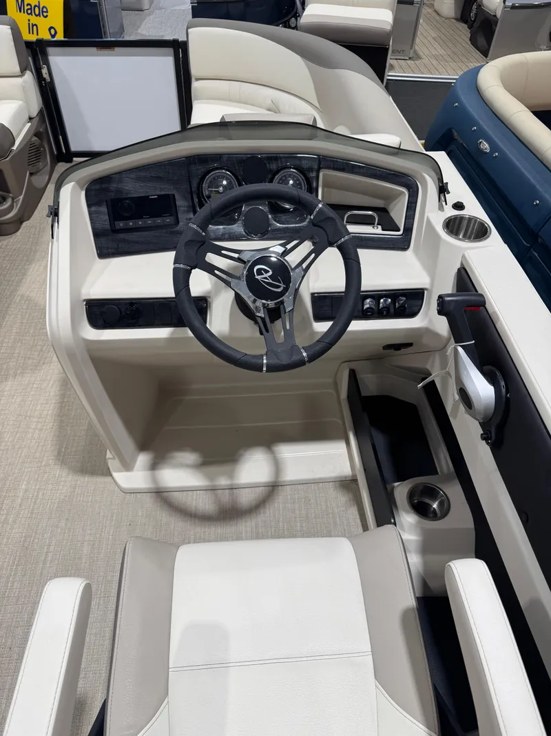 Slide: The Image of 2024 Avalon 2385 25 LSZ QL boat cockpit with modern steering and controls. - 4