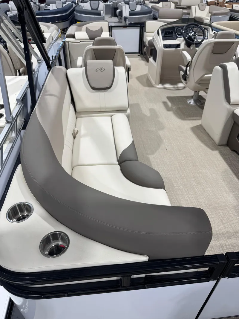 Slide: The Image of 2024 Avalon 2385 25 LSZ QL pontoon boat interior with plush seating and cup holders. - 7