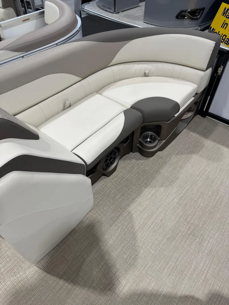 Slide: The Image of 2024 Avalon 2385 25 LSZ QL boat seating with beige and gray upholstery. - 9