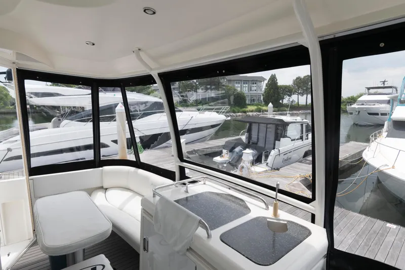 Slide: The Image of 2008 Cruisers Yachts 415 Express Motoryacht interior with docked boats view. - 12