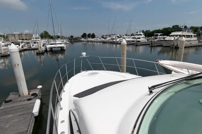 Slide: The Image of 2008 Cruisers Yachts 415 Express Motoryacht docked in a marina with other boats. - 15