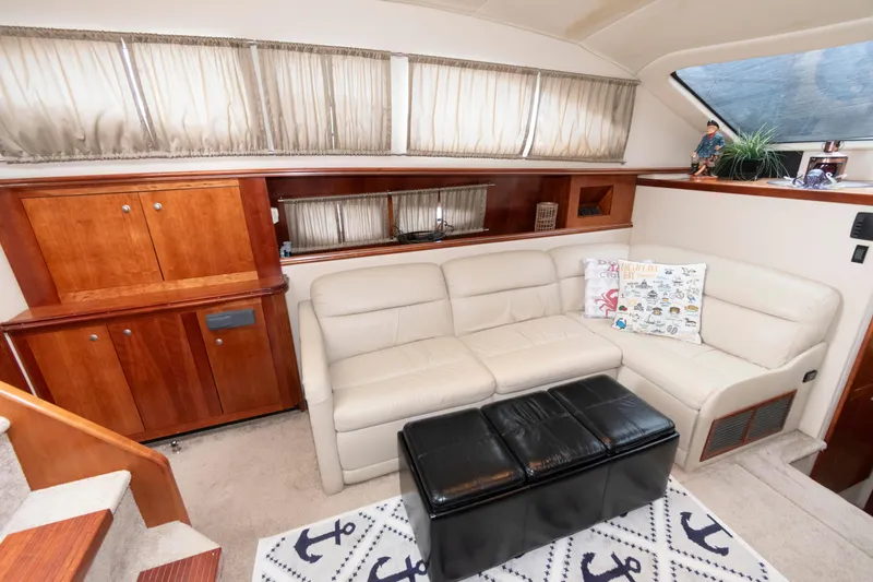 Slide: The Image of Luxurious interior of 2008 Cruisers Yachts 415 Express Motoryacht with leather seating and wooden cabinetry. - 19