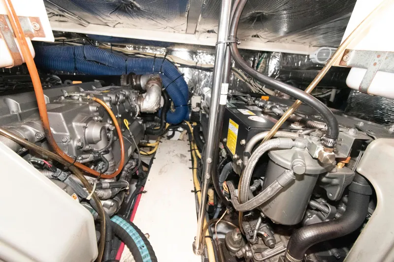 Slide: The Image of Engine room of 2008 Cruisers Yachts 415 Express Motoryacht, showcasing dual engines and mechanical components. - 29