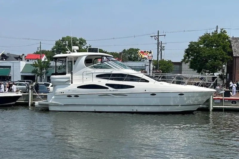 Slide: The Image of 2008 Cruisers Yachts 415 Express Motoryacht docked in a marina. - 3