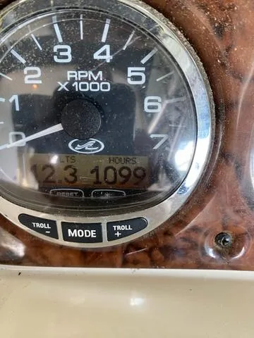 Slide: The Image of Close-up of 2004 Sea Ray 260 Sundancer RPM gauge showing 1099 hours. - 10