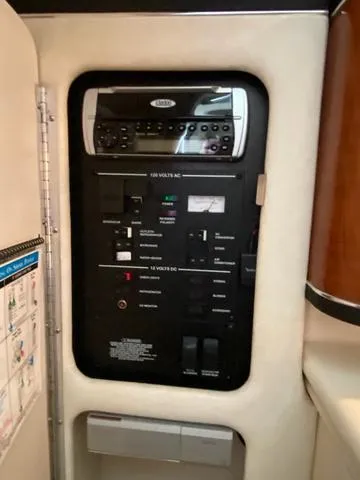 Slide: The Image of Electrical control panel inside 2004 Sea Ray 260 Sundancer boat. - 13