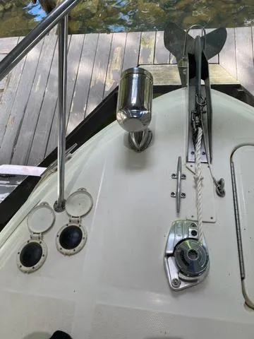 Slide: The Image of 2004 Sea Ray 260 Sundancer boat deck with anchor and winch system. - 19
