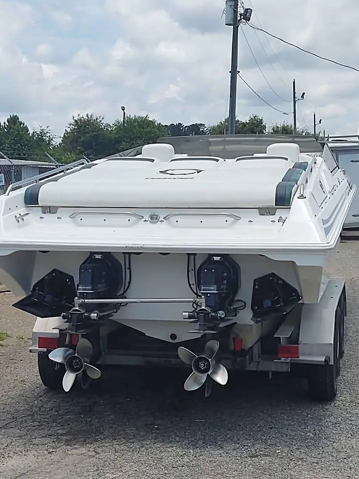 Slide: The Image of 1996 Fountain 32 Fever boat on trailer, rear view with dual propellers. - 2