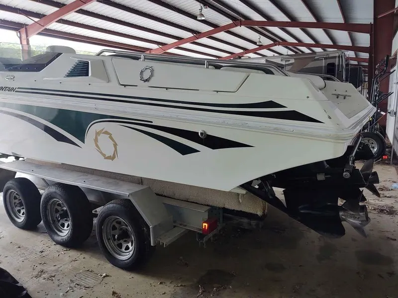 Slide: The Image of 1996 Fountain 32 Fever boat on trailer in storage facility. - 4