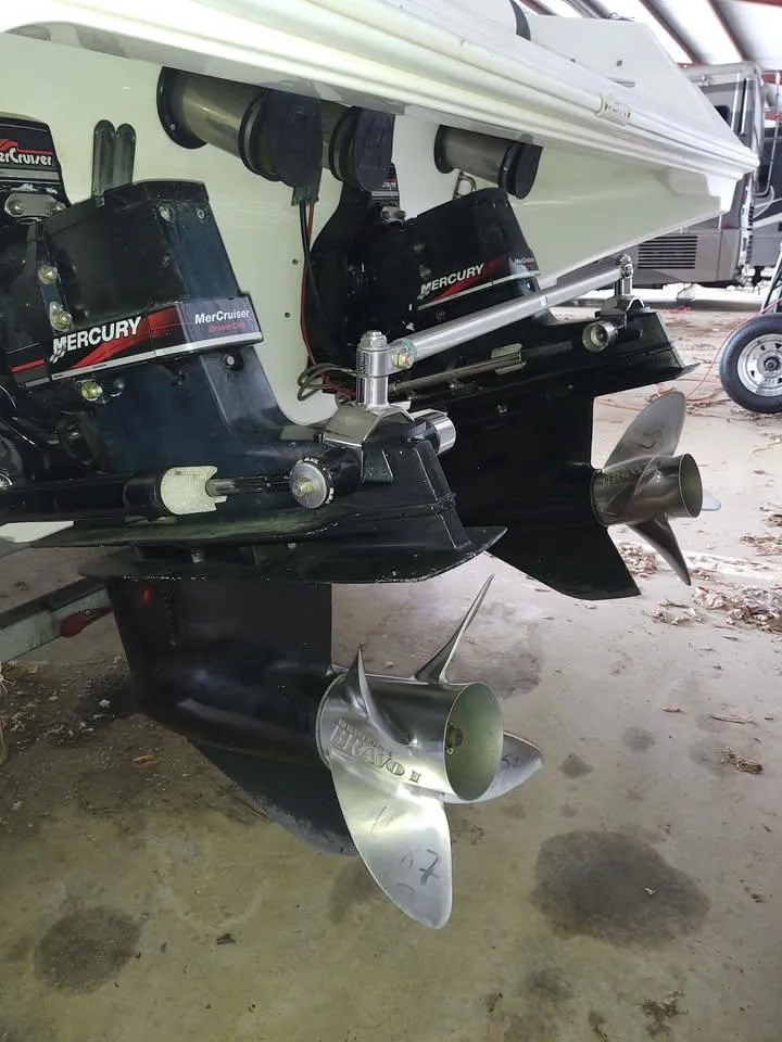 Slide: The Image of 1996 Fountain 32 Fever boat with dual Mercury outboard motors and stainless steel propellers. - 8