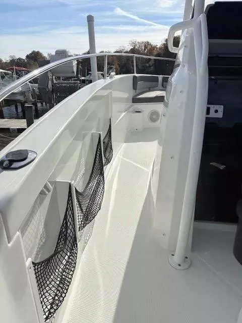 Slide: The Image of 2020 Jeanneau Leader 9.0 CC boat deck with storage nets and seating area. - 17