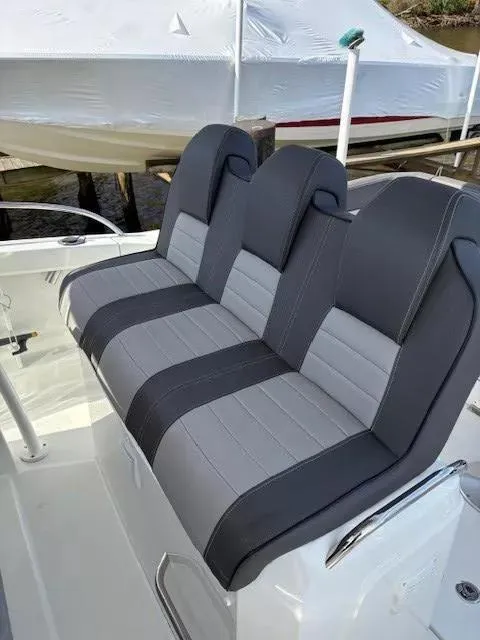 Slide: The Image of 2020 Jeanneau Leader 9.0 CC boat seats, featuring sleek gray upholstery. - 19