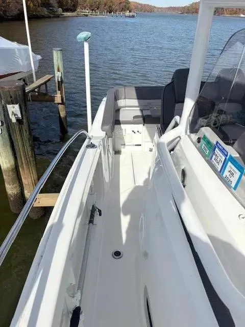 Slide: The Image of 2020 Jeanneau Leader 9.0 CC boat docked by a serene lake. - 21