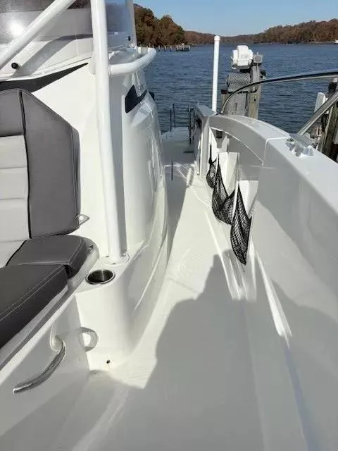 Slide: The Image of 2020 Jeanneau Leader 9.0 CC boat deck with seating and water view. - 22