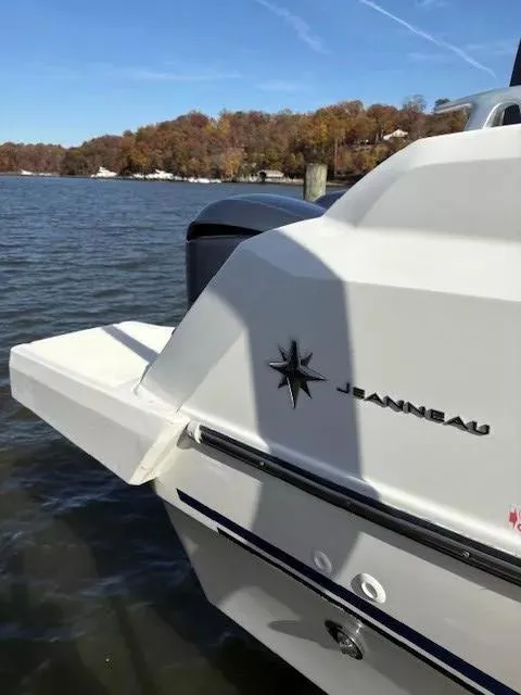 Slide: The Image of 2020 Jeanneau Leader 9.0 CC boat on a scenic lake with autumn trees. - 8