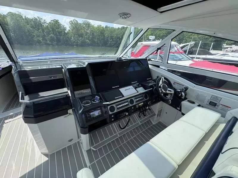 Slide: The Image of 2020 Formula 430 Super Sport Crossover cockpit with modern navigation equipment and comfortable seating. - 10