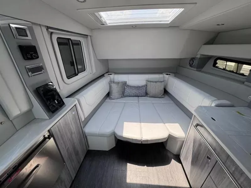 Slide: The Image of 2020 Formula 430 Super Sport Crossover interior with modern seating and skylight. - 12