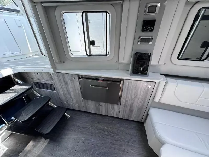 Slide: The Image of Interior of 2020 Formula 430 Super Sport Crossover, featuring modern cabinetry and seating. - 13