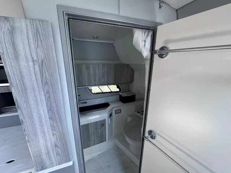 Slide: The Image of Interior of 2020 Formula 430 Super Sport Crossover bathroom with modern design and wood accents. - 15