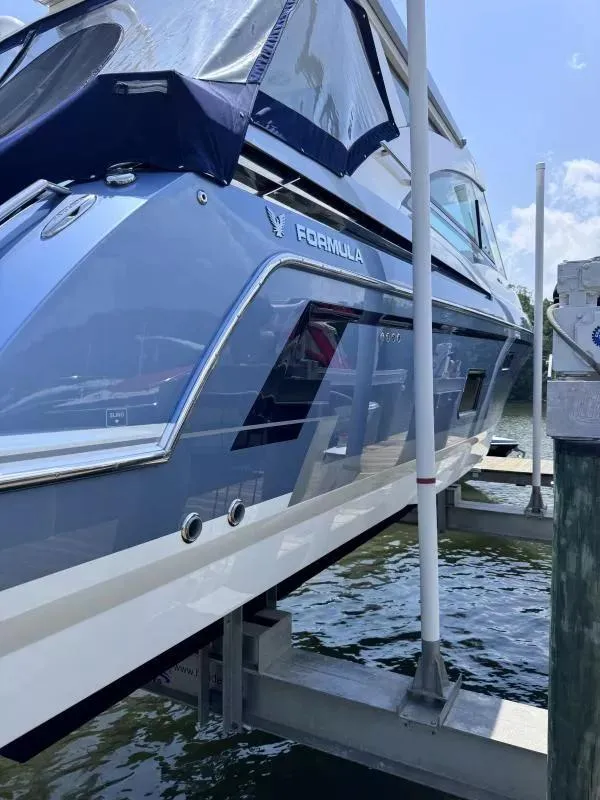 Slide: The Image of 2020 Formula 430 Super Sport Crossover yacht docked on a lift. - 3